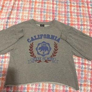 long sleeve crop top the brand is Mod Ern Lux.